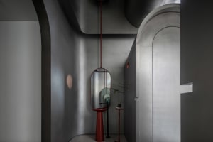 Minimalist industrial interior with metallic finishes and geometric shapes.