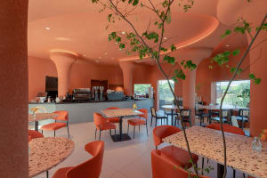 A modern coffee shop with terrazzo and terracotta decor.