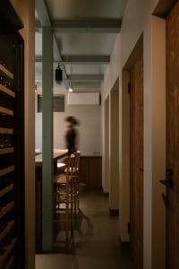 A corridor with wooden floors and modern design elements.