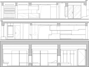 A detailed architectural floor plan of an interior space, featuring lines, crosses, and annotations on paper.