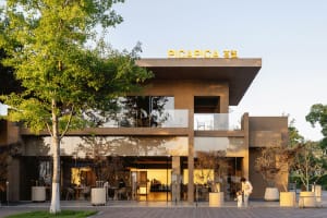 A modern commercial building with glass façade and minimalist design.