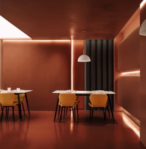 A modern restaurant interior with metal furniture and white pendant lights.