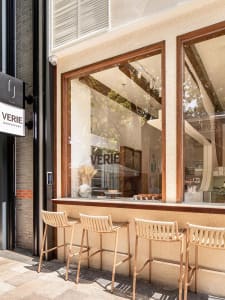 Outdoor seating and window display of a modern retail store
