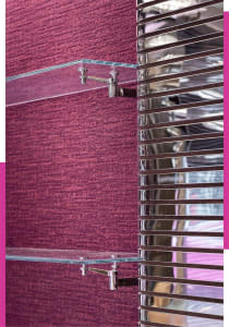 Modern glass shelves mounted on a textured, purple wall with metallic accents.