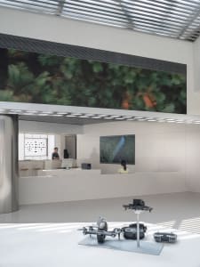 A modern office space with minimalist interior design, white walls, and a sleek, open layout.