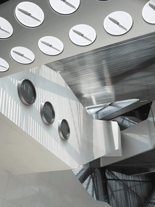A metallic ceiling with circular elements.