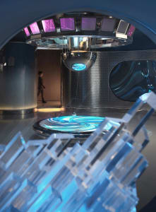 A modern laboratory interior featuring metallic and glass elements.