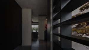 A modern interior space featuring glass elements.