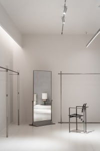 A modern storefront with metal frames and glass panels.