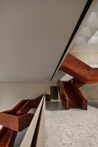 A modern wooden staircase with a sleek, clean design.