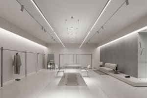 Modern minimalist retail store featuring metal, glass, and white materials
