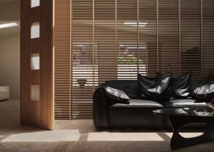 Modern black leather sofa in a contemporary living room setting with minimalistic decor.