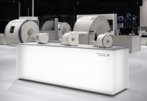 United Imaging's white medical devices on display at an exhibition.