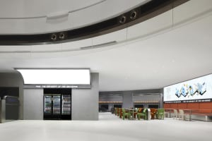 Industrial interior with concrete walls and glass partitions.