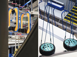 Industrial playground with metal structures and rubber swings.