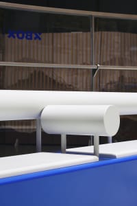 Modern shopfront featuring an aluminum railing with a sleek, contemporary design.