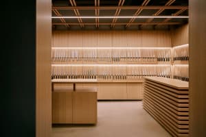 A minimalist retail space featuring a wooden knife display.