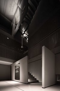 A modern office space with concrete, metal, and wooden elements.