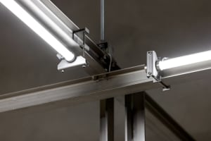 Steel beams and fluorescent light fixtures in an industrial setting