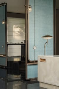 Modern bathroom featuring marble and glass elements