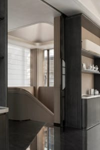 Modern hotel spa interior featuring wooden walls and concrete columns.