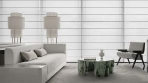 A modern living room featuring a white sofa with green marble coffee table and floor lamps.