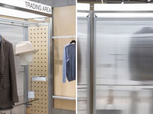 A trading area display featuring metal shelving and clothing racks.