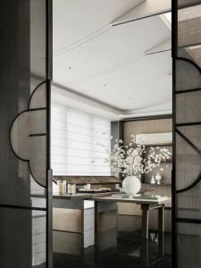 Modern minimalist living room featuring a white marble table with a white vase and book, black marble floor, and white wooden