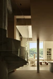 A modern residential interior featuring concrete materials and contemporary design elements.