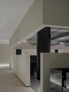 Minimalist interior design featuring concrete columns and floors.