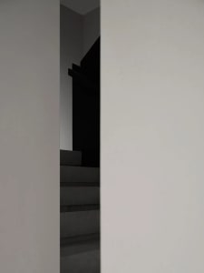 A minimalist stairwell constructed of concrete.