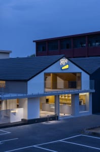 Modern storefront with large glass windows and a prominent sign reading 'healing pets'.