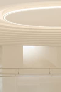 A modern interior space featuring glass ceiling for aesthetic and functional purposes in a contemporary design setting.