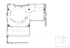 Floor plan of a modern office space with open areas and functional zones.