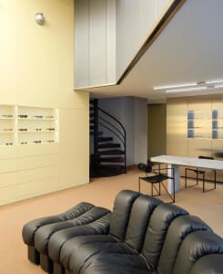 Modern retail storefront with concrete and glass elements.
