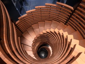 A spiral staircase made of terracotta tiles