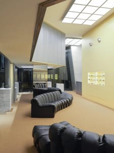 A modern retail store with neutral colors and concrete elements.