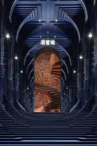 A contemporary, industrial-style library interior designed with wooden elements and archways.