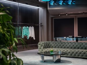 A modern retail space featuring metallic glass elements.