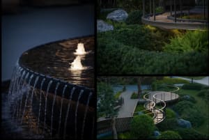 A garden scene featuring a winding path, a round water feature, and various plants and rocks, illuminated by soft, ambient li