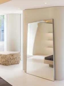 A minimalist interior space featuring modern glass elements and sleek, contemporary design.