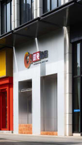 Modern storefront with stainless steel frame and white background