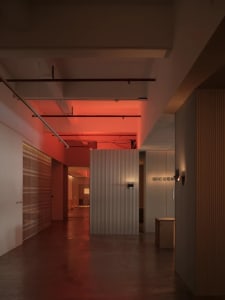 Modern industrial-style office space featuring a concrete panel on the wall