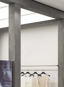 A clothing display featuring metallic hangers in a modern retail space.