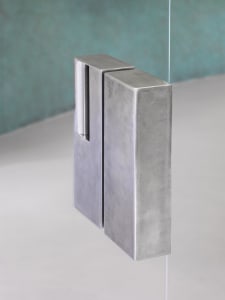 modern metal handle on a glass door