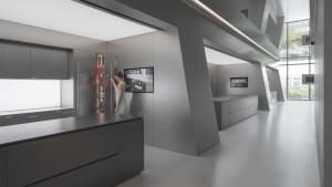 A modern metallic kitchen with sleek, minimalist design.