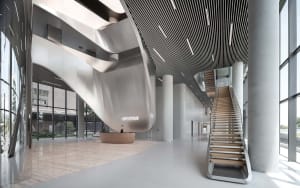 Modern office reception area with metallic concrete elements, featuring a curved wall and a spiral staircase.
