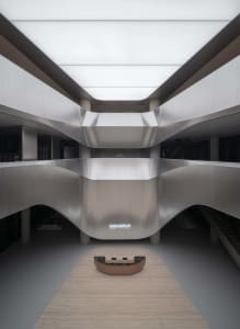 Modern office space featuring sleek, metallic design elements.