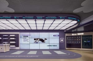 Keep fitness center with digital display showing instructions for abdominal exercises, yoga mats, and motivational messages.