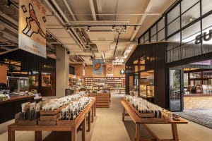 A spacious pet shop interior with various sections for pet supplies and accessories.